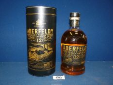 A 70 cl bottle of Aberfeldy Highland 12 year old Single Malt Whisky in a tin tube.