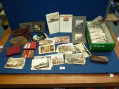 A quantity of miscellanea including old postcards and an old family album dated 1911,