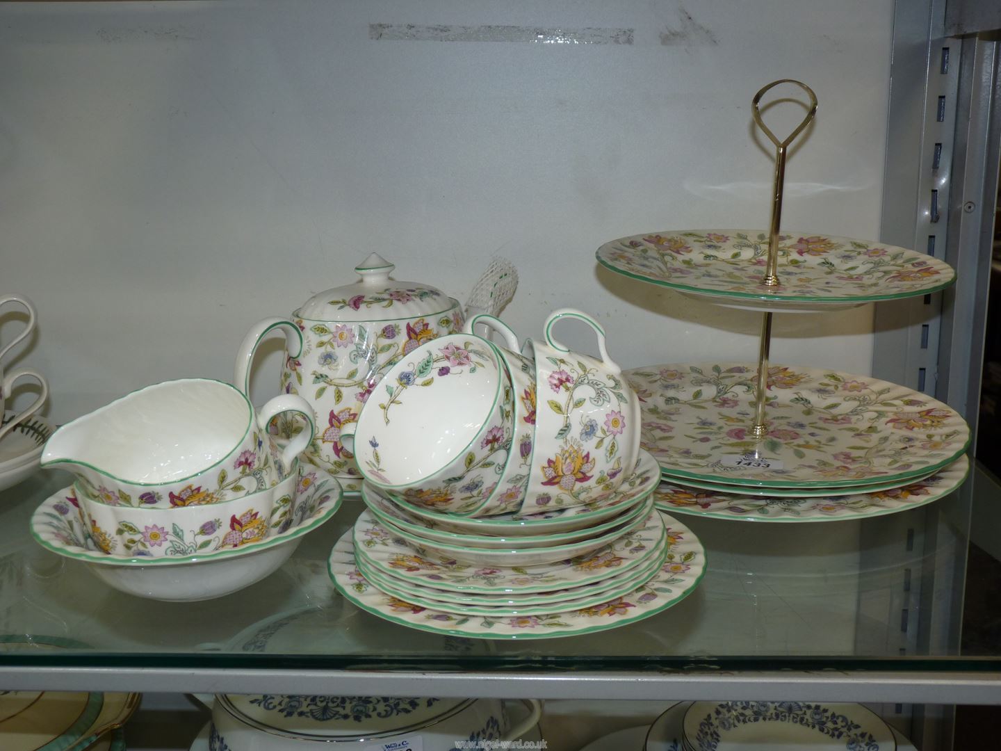 A Minton ''Haddon Hall" part teaset including teapot, three cups and saucers, three tea plates,
