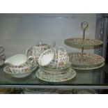 A Minton ''Haddon Hall" part teaset including teapot, three cups and saucers, three tea plates,