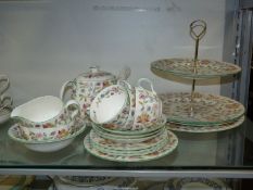 A Minton ''Haddon Hall" part teaset including teapot, three cups and saucers, three tea plates,