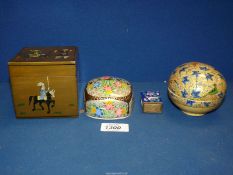 Three small lacquered papier mache trinket boxes and an enamelled matchbox holder.