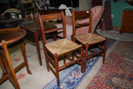 A pair of 19th c Mahogany side Chairs having turned legs and stretchers and seagrass seats,