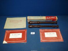 Two Dolmetsch 'Dolonite' Descant Recorders, one boxed, also three descant recorder books.