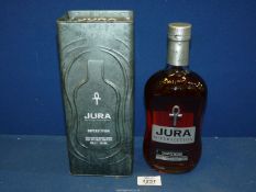 A 70 cl bottle of Jura Superstition Single Malt Whisky in tin.