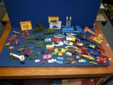 A quantity of die-cast vehicles including Dinky, Corgi and Lesney.