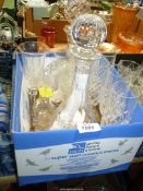 A small quantity of glass including two cut glass decanters, four champagne flutes,
