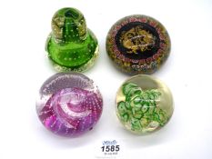 Four glass paperweights including a "Millefleur "pisces" paperweight, Caithness, Cauldon Ruby",