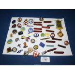 A quantity of enamel badges including Co-Co Club,