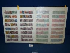 An album of British stamps from Queen Victoria to Queen Elizabeth II, many duplicates.