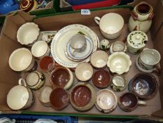 A quantity of Devonware to include cups, saucers, jugs, vases, plates, etc.