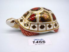 A Royal Crown Derby Tortoise paperweight with gold stopper.