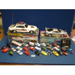 A battery operated Police car and remote controlled Ferrari, (a/f),