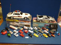 A battery operated Police car and remote controlled Ferrari, (a/f),