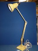 A Herbert Terry & Sons adjustable desk lamp.