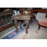 An Eastern hardwood design square Occasional Table standing on elephant head legs,