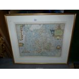 A framed print of a Saxton's Map of England and Wales 1579.