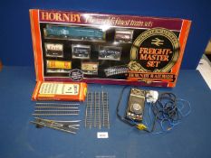 A Hornby Train set (Master Freight) with Hornby power unit and boxed railway OO gauge track.