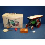 A boxed Mamod steam Tractor with steering rod, scuttle, etc.