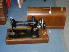A hand Singer Sewing machine.