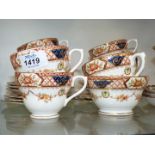 A Sutherland china tea set; six each cups, saucers and tea plates and a milk jug and sugar bowl.