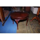 A circular Mahogany occasional Table standing on cabriole legs, 22 1/2'' diameter x 16 3/4'' high.