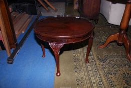 A circular Mahogany occasional Table standing on cabriole legs, 22 1/2'' diameter x 16 3/4'' high.