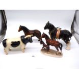 A Coopercraft Friesian bull, horse and foal ornament, shire horse in full harness, etc.