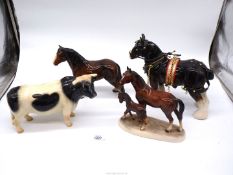 A Coopercraft Friesian bull, horse and foal ornament, shire horse in full harness, etc.