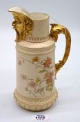 A Royal Worcester Blush Ivory jug with moulded mask and spout, painted with flowers,