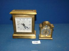 A very heavy brass "Europa" quartz Carriage clock and a smaller one by "Swiza" marked "Tempus
