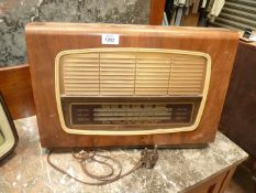 A vintage Regentone Radio, some woodworm holes, 19 3/4" wide x 13 1/4" tall.