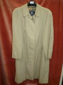 A Ladies Burberry tan trench coat 100% cotton, size 12 Reg,