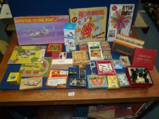 A quantity of vintage games including Chad Valley, "the Acroball" game, toy squeeze box,