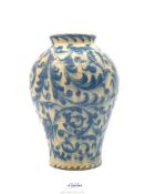 An Arts & Crafts pottery vase with Dolphins swimming in sea grasses, some damage and crazing,