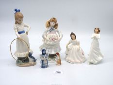 A small quantity of china figures including Nao girl with hoop (loose hoop),