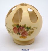 A Royal Worcester blush ivory spherical pierced Potpourri having painted flowers, 3 1/2" tall,