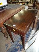 A 19th c rear swing-leg Mahogany flap over Tea Table standing on tapering square legs,