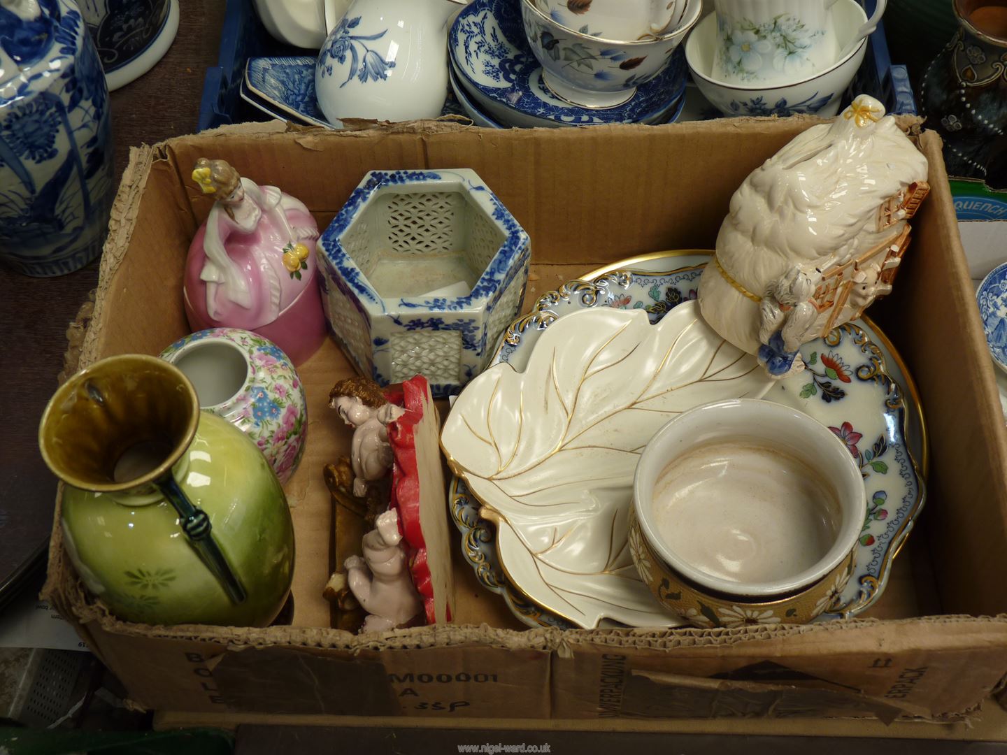 A quantity of china including Carltonware plate, cherub plaque, crinoline lady trinket pot, etc.