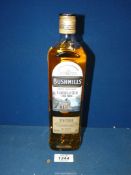 A 70 cl bottle of Bushmills Irish Whisky with Caribbean rum finish.