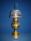 A brass based Oil Lamp with brass reservoir and pretty etched glass shade, 10 1/2'' tall.