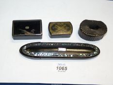 A collection of three antique papier mache pill/snuff boxes and papier mache glasses case.