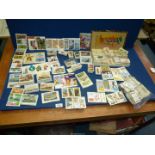 A quantity of cigarette and tea cards.