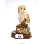 A Royal Doulton Barn Owl on wooden plinth.