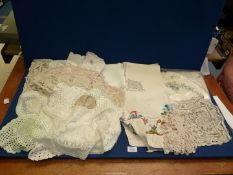 A quantity of linen to include napkins, crocheted table cloths, etc.