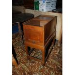 A tambour topped Oak Filing Cabinet/Chest standing on a base with perimeter stretchers,