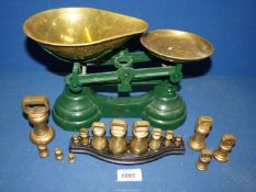 A pair of Librasco scales with two sets of brass weights.