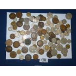 A quantity of pre-decimal coins including threepenny bits, sixpences, halfpennies, pennies etc.