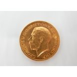 A 1913 George V, Gold sovereign, 8.04gm.