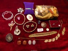 A quantity of costume jewellery including a 'Miracle' flower brooch,